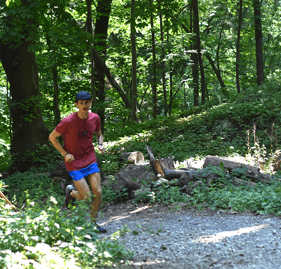 Coach Chris running on trail