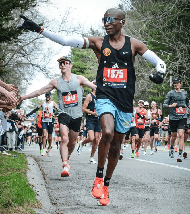 Marathon runner carrying an energy gel during a race