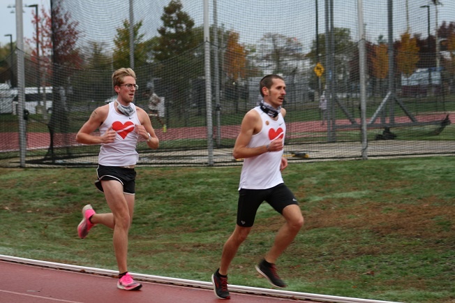 Coach Chris and Lion John running a speed development fast track workout.