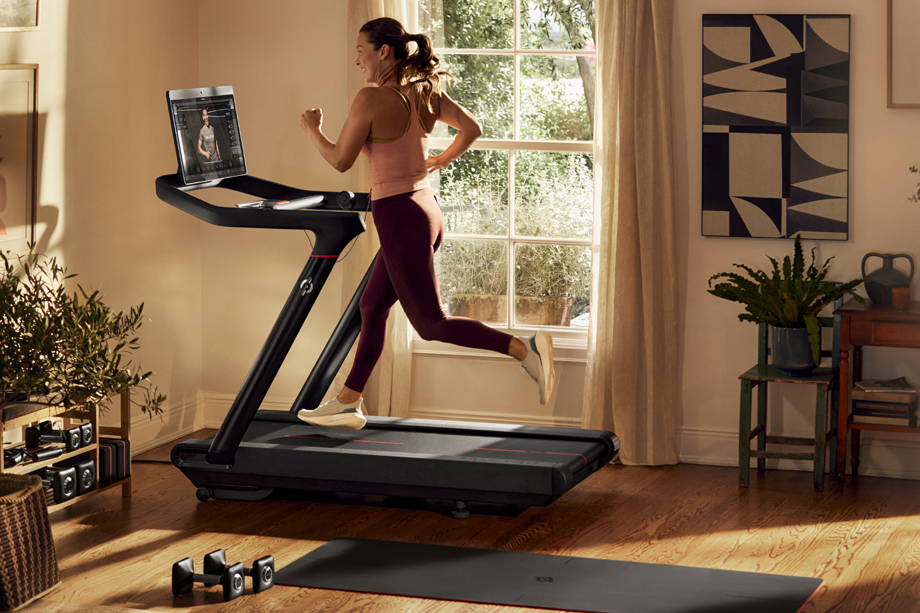 Photo of Woman Marathon Training on Peloton Treadmill.