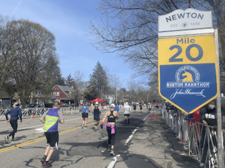 Athletes Running at Mile 20 of the Boston Marathon, in Newton, Massachusetts.