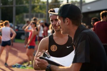 Coach Coach and his Athlete Talk at Running Track