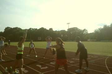 Knighton Lions warm up at running track