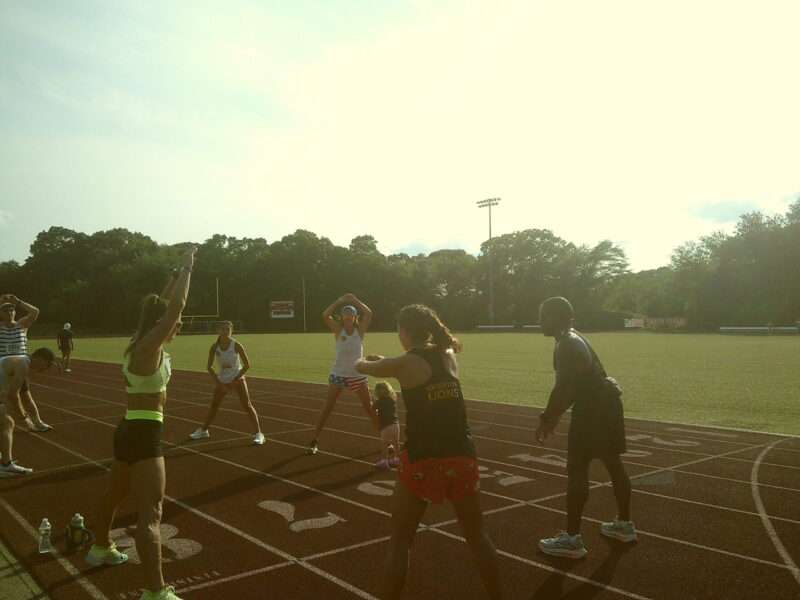 Knighton Lions warm up at running track